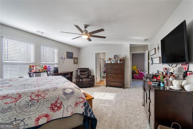 bedroom with ceiling fan and light colored carpet