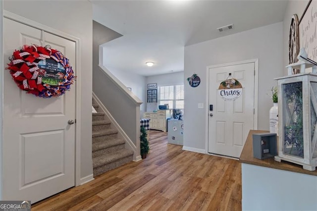 foyer entrance featuring hardwood / wood-style floors