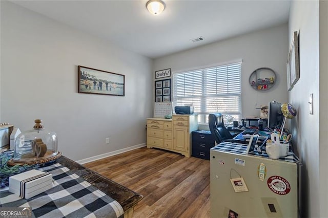 office space with dark wood-type flooring