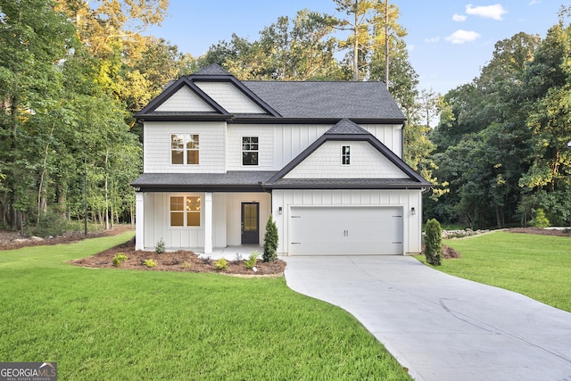 view of front facade with a front lawn, covered porch, and a garage