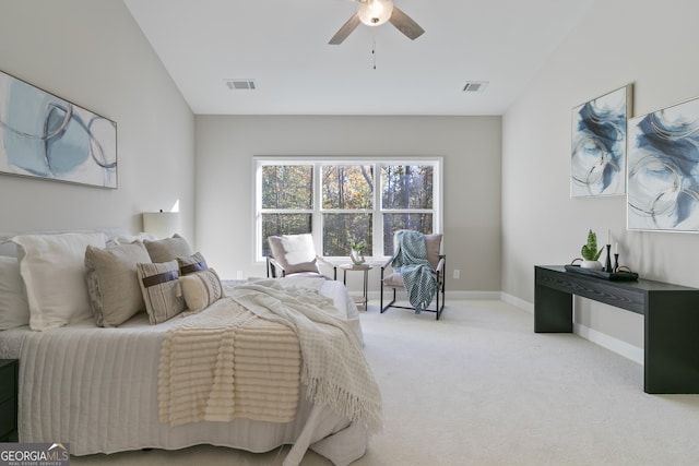 carpeted bedroom featuring ceiling fan and vaulted ceiling