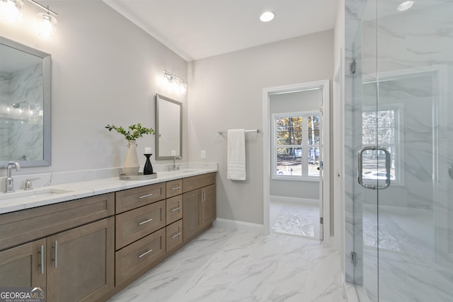 bathroom featuring a shower with shower door and vanity