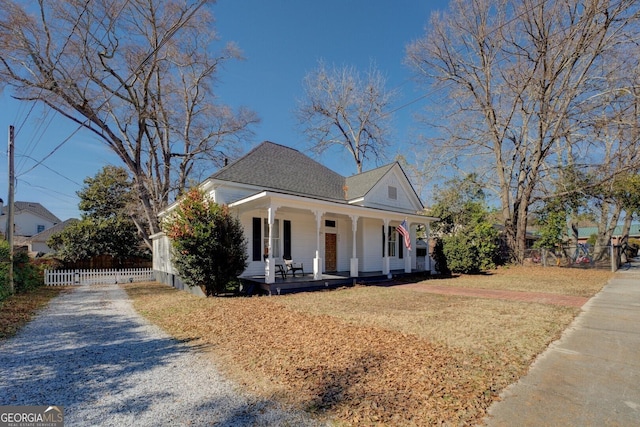 view of front facade with a front yard and a porch