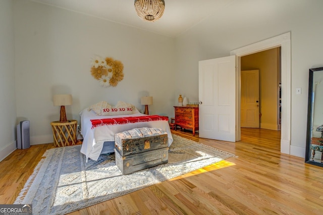 bedroom with wood-type flooring