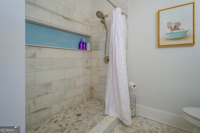 bathroom with toilet and curtained shower