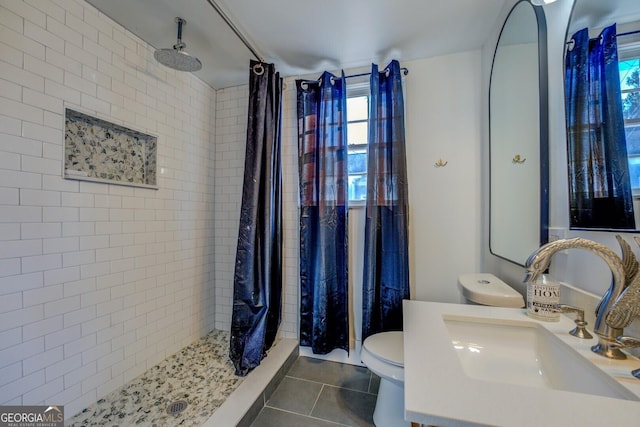 bathroom featuring toilet, tile patterned flooring, a shower with curtain, and vanity