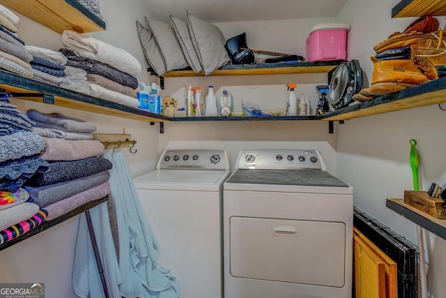 clothes washing area with washing machine and clothes dryer