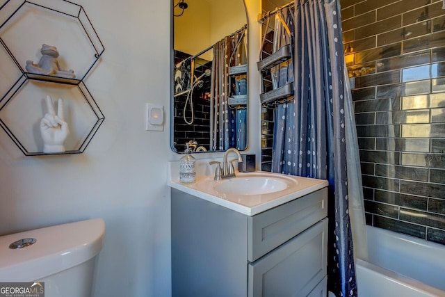 full bathroom featuring toilet, shower / bath combo, and vanity