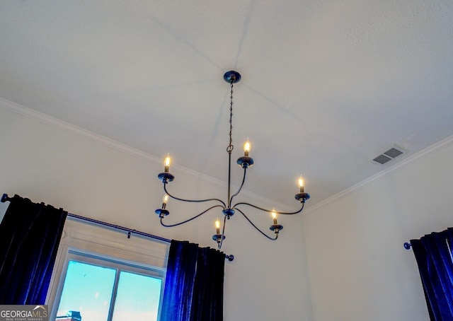 room details featuring crown molding and a chandelier