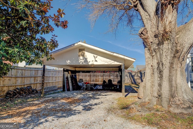 view of side of property with a carport