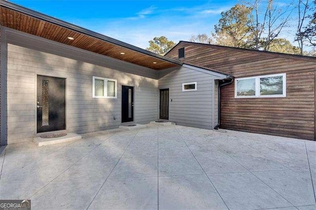 rear view of property featuring a patio