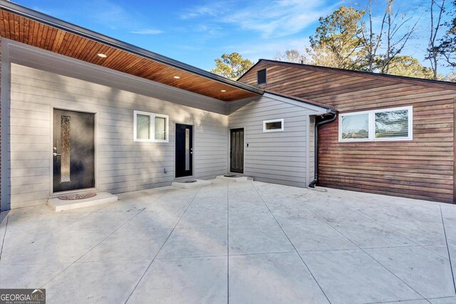 rear view of property with a patio
