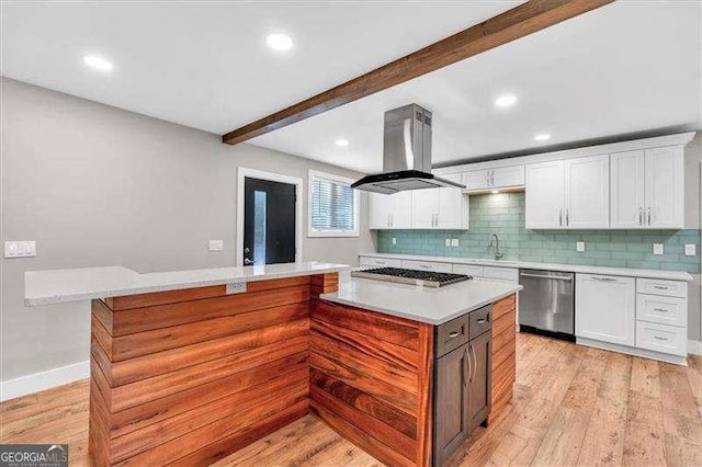 spare room featuring baseboards, crown molding, ceiling fan, and wood finished floors