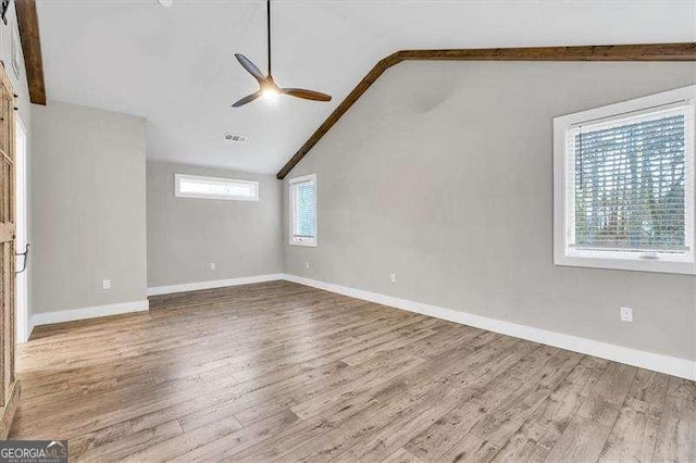 bathroom featuring baseboards and toilet