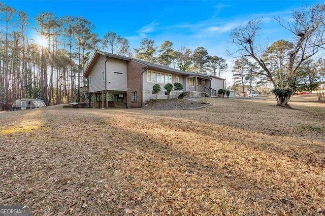 view of property exterior featuring a yard