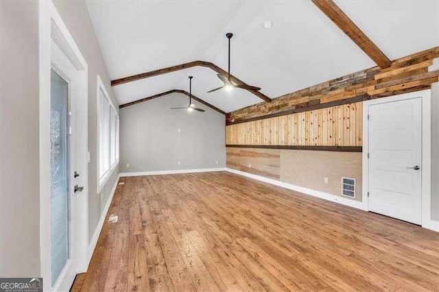 kitchen featuring a sink, dishwasher, light countertops, baseboards, and visible vents