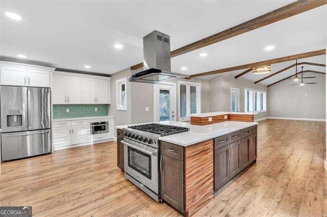 kitchen featuring light countertops, white cabinets, stainless steel appliances, and island exhaust hood