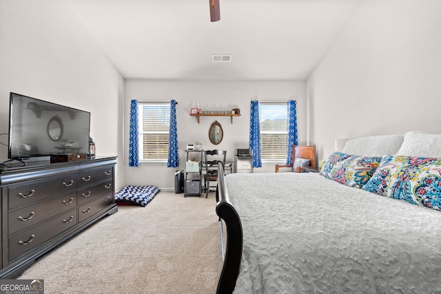 carpeted bedroom with ceiling fan