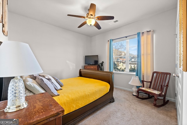 bedroom with light carpet and ceiling fan