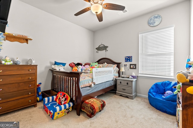 carpeted bedroom with ceiling fan