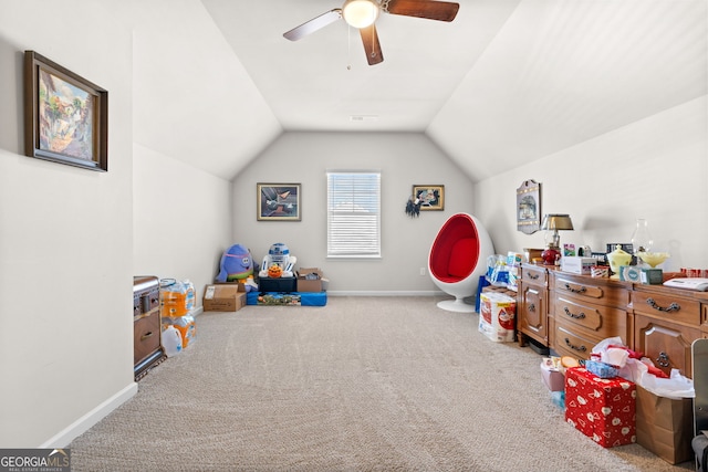 playroom with light carpet, vaulted ceiling, and ceiling fan