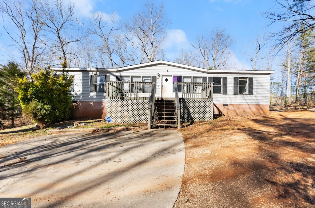 view of front of house with a wooden deck