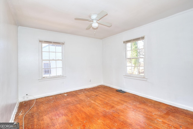 unfurnished room featuring ceiling fan, ornamental molding, and wood-type flooring