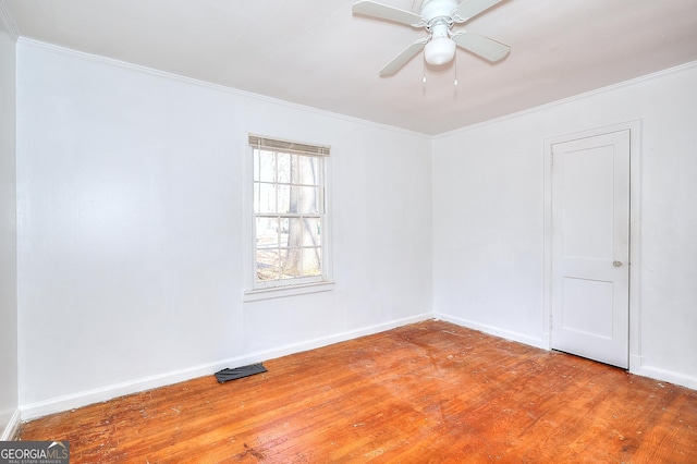 unfurnished room featuring ceiling fan, wood-type flooring, and crown molding