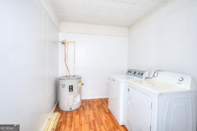 laundry room featuring light wood-type flooring, ornamental molding, independent washer and dryer, and electric water heater