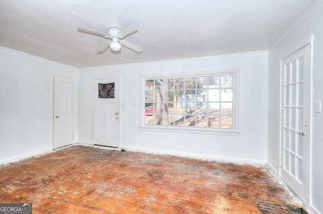 unfurnished room featuring ceiling fan and ornamental molding