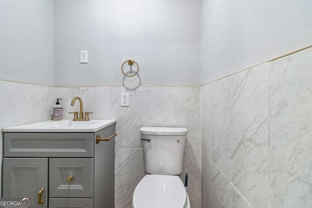 bathroom featuring toilet and vanity