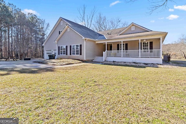 view of front facade featuring covered porch, a garage, and a front lawn