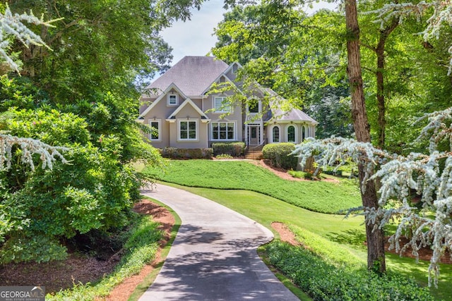 4225 Dunham Park, Flowery Branch, GA 30542 - view of front of house with a front yard and stucco siding