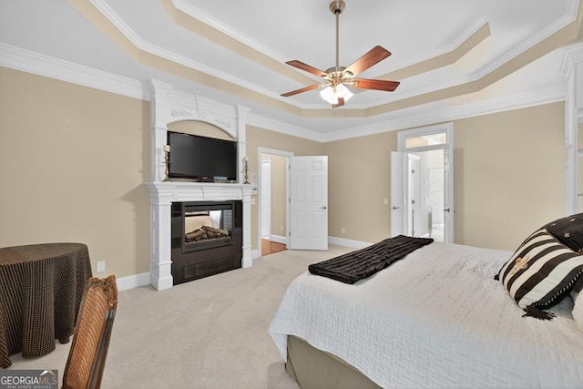 4225 Dunham Park, Flowery Branch, GA 30542 - bedroom with a tray ceiling, light carpet, crown molding, a multi sided fireplace, and a ceiling fan