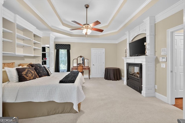 4225 Dunham Park, Flowery Branch, GA 30542 - bedroom with a raised ceiling, a large fireplace, light colored carpet, crown molding, and a ceiling fan