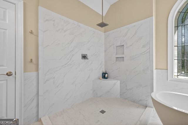 4225 Dunham Park, Flowery Branch, GA 30542 - bathroom featuring a soaking tub, tile walls, tiled shower, and wainscoting