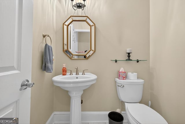 4225 Dunham Park, Flowery Branch, GA 30542 - half bathroom featuring toilet and baseboards