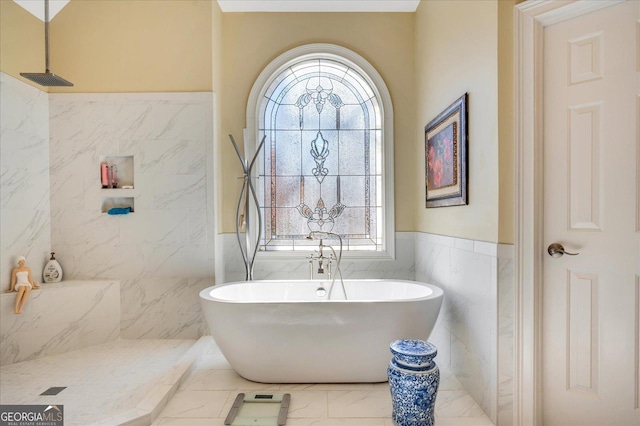 bathroom featuring independent shower and bath and tile walls