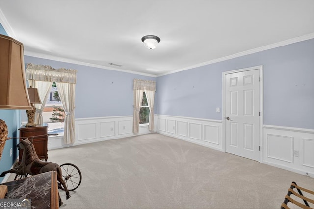 4225 Dunham Park, Flowery Branch, GA 30542 - sitting room featuring carpet, crown molding, wainscoting, and a decorative wall