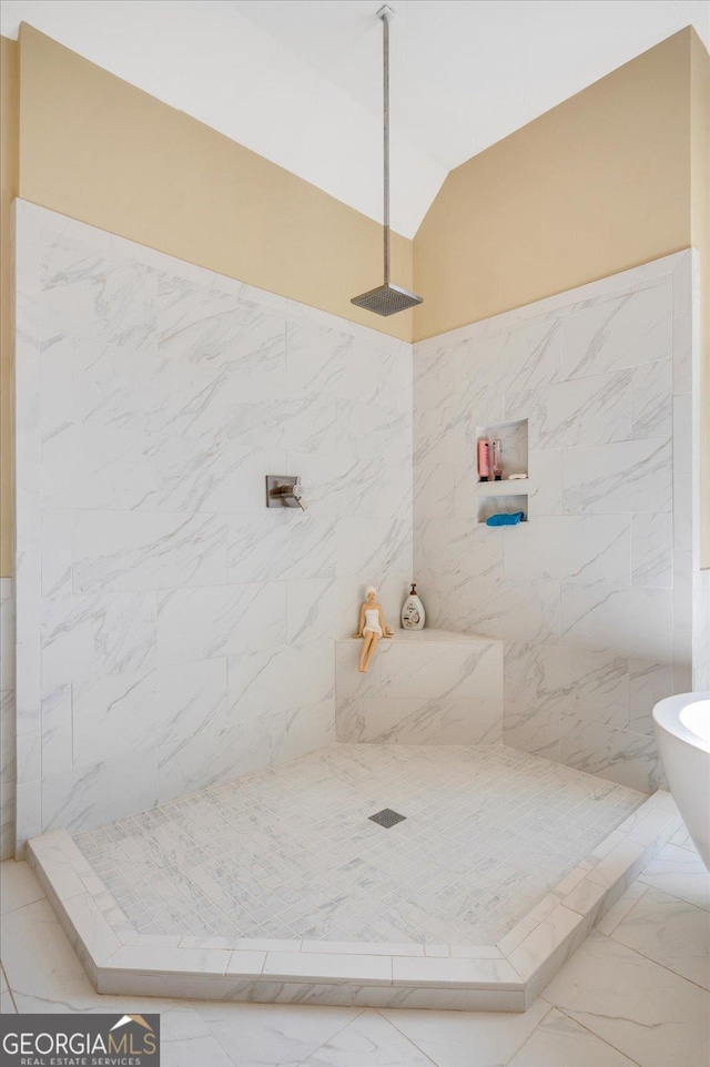 bathroom with vaulted ceiling and walk in shower