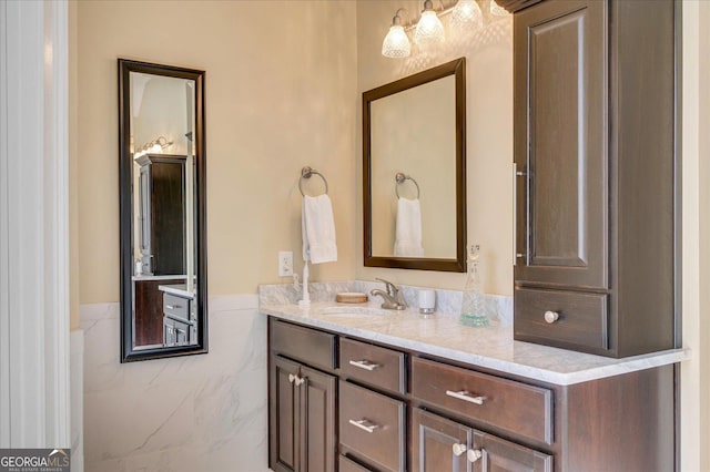 bathroom featuring tile walls and vanity