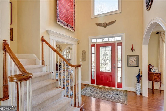 entrance foyer featuring hardwood / wood-style floors and a high ceiling