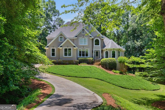 4225 Dunham Park, Flowery Branch, GA 30542 - view of front facade featuring a front lawn