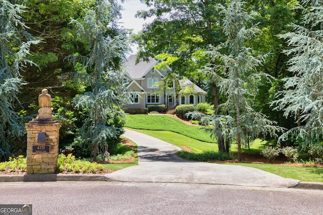 4225 Dunham Park, Flowery Branch, GA 30542 - view of front of home with a front lawn