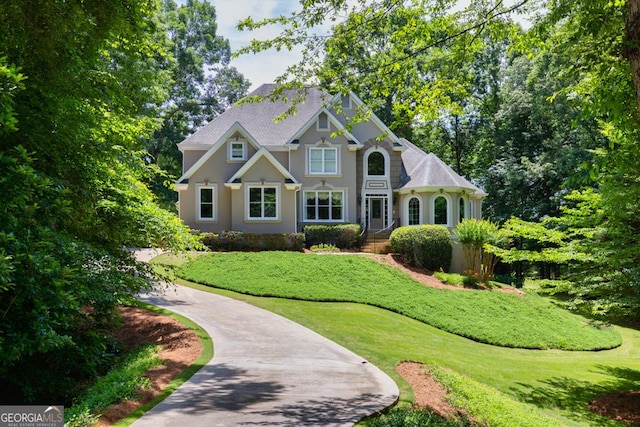 4225 Dunham Park, Flowery Branch, GA 30542 - view of front of home with a front yard