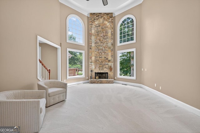 4225 Dunham Park, Flowery Branch, GA 30542 - unfurnished living room featuring a towering ceiling, carpet floors, a fireplace, and ceiling fan