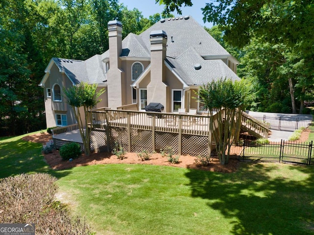4225 Dunham Park, Flowery Branch, GA 30542 - back of property featuring a deck, a chimney, roof with shingles, and stucco siding