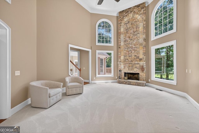 4225 Dunham Park, Flowery Branch, GA 30542 - unfurnished living room featuring a high ceiling, ceiling fan, carpet floors, a fireplace, and stairway