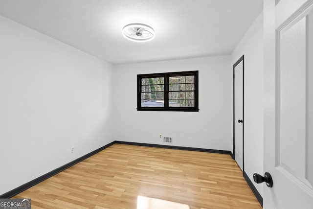 empty room featuring hardwood / wood-style floors