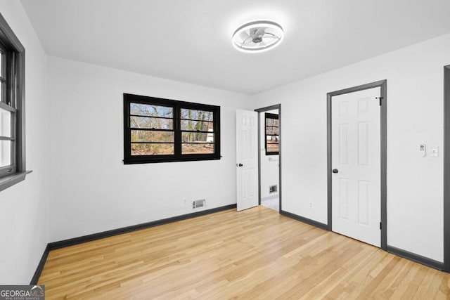 unfurnished bedroom with light hardwood / wood-style flooring